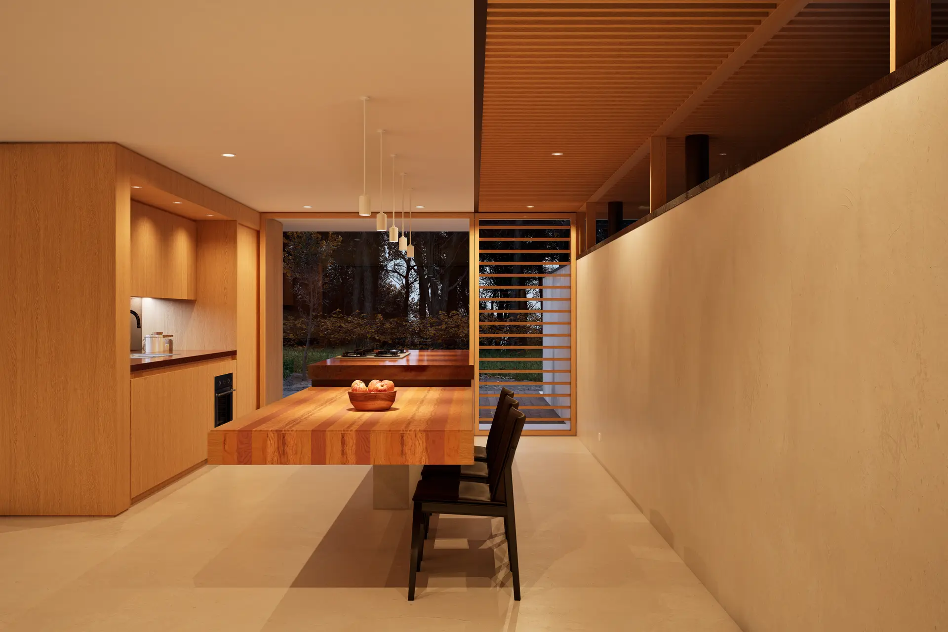 Long kitchen with warm wood cabinets and a dining table